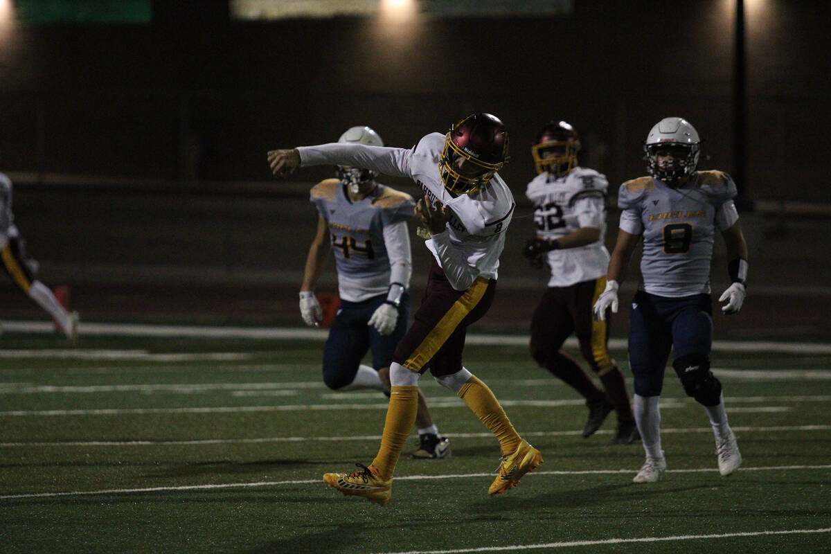 PVHS senior QB hucks a ball downfield in an away league game against Boulder City High School. ...