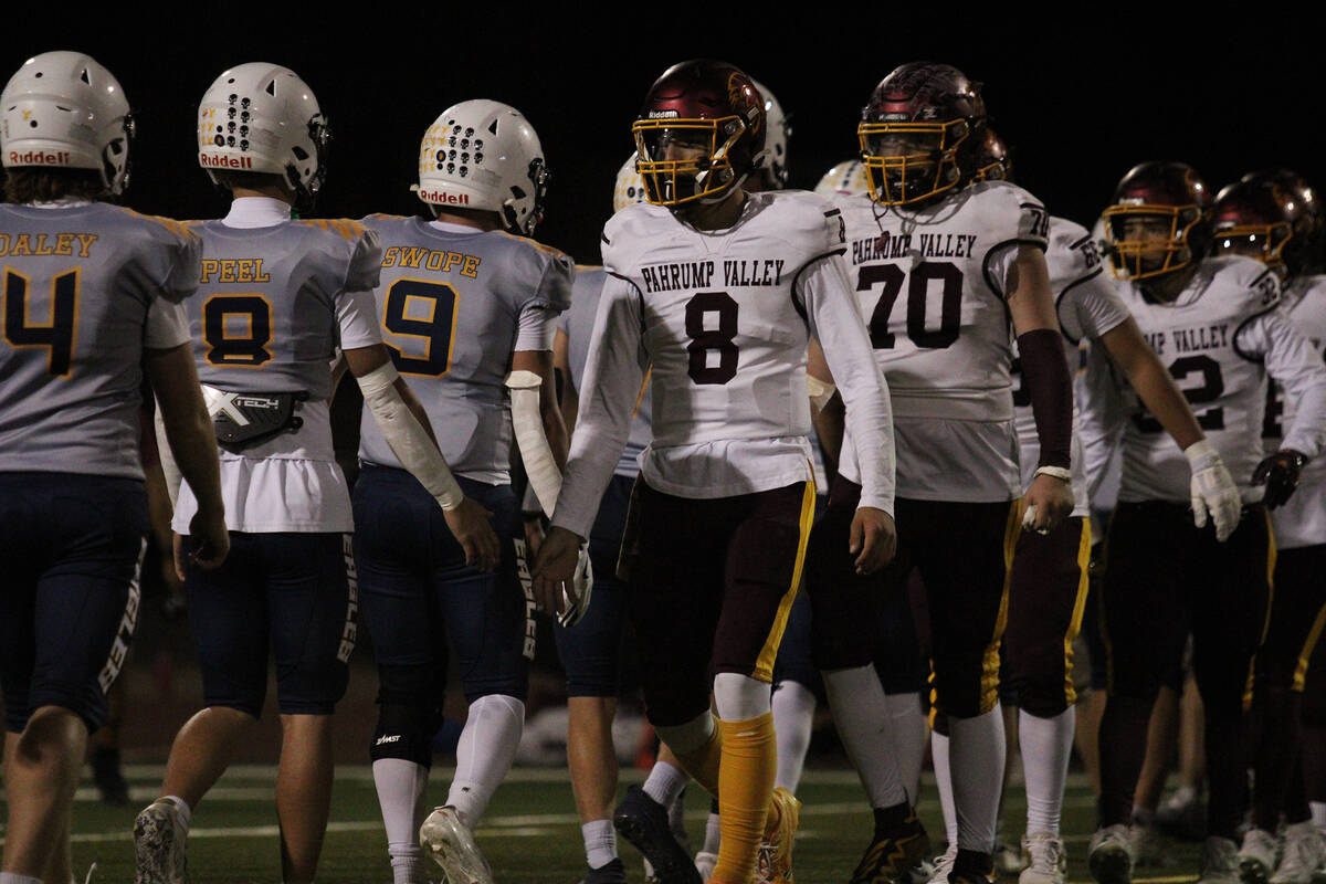 The Pahrump Valley High School football team says good game to their rivals Boulder City during ...