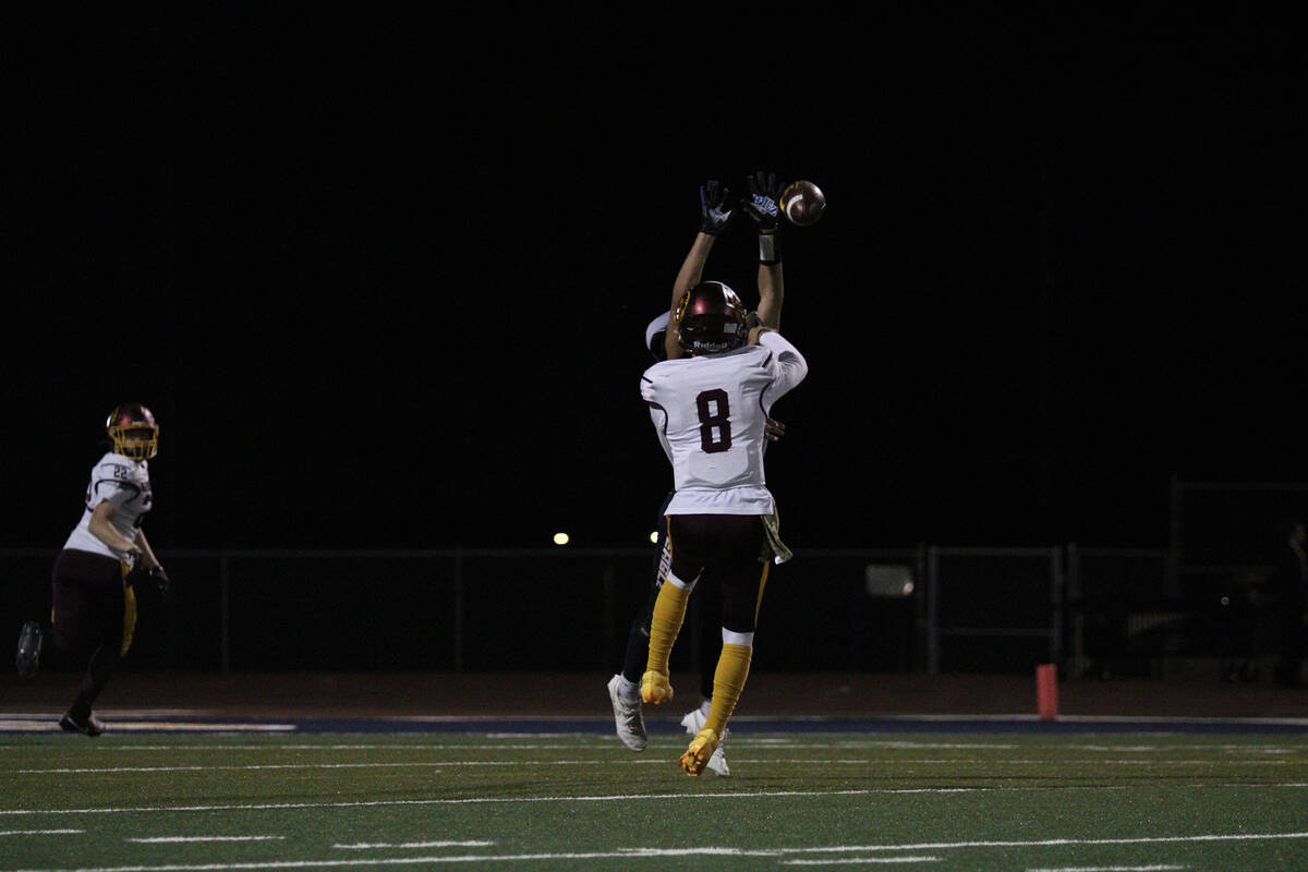 PVHS senior QB Kayne Horibe attempts to complete a pass in goal line to junior TE/DE Paul Walke ...