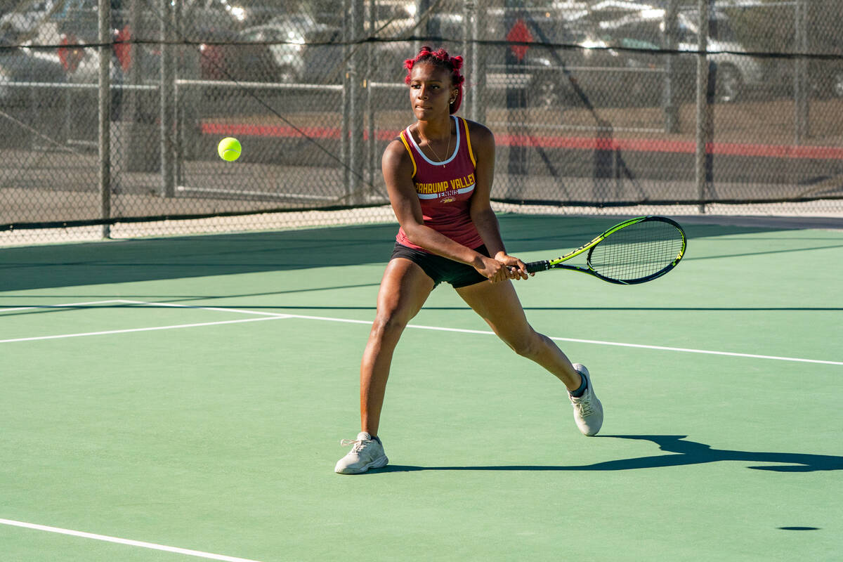 Pahrump Valley High School tennis junior Chanel Anthony loads up to return a serve during the 3 ...