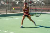 Pahrump Valley High School tennis junior Chanel Anthony loads up to return a serve during the 3 ...