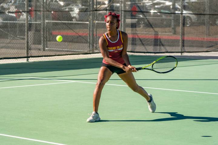 Pahrump Valley High School tennis junior Chanel Anthony loads up to return a serve during the 3 ...