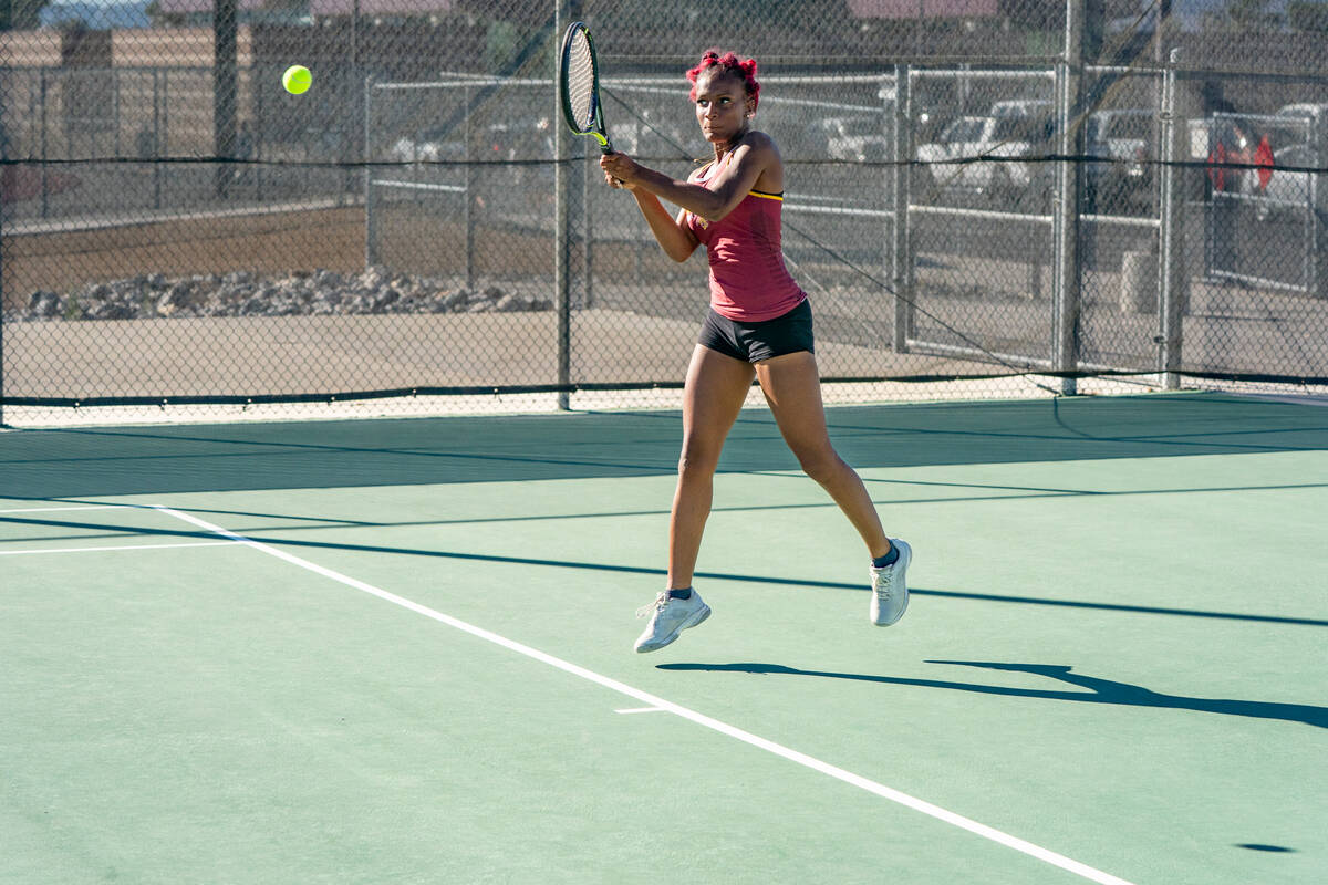 PVHS tennis junior Chanel Anthony returns a serve to her opponent during the 3A Southern League ...