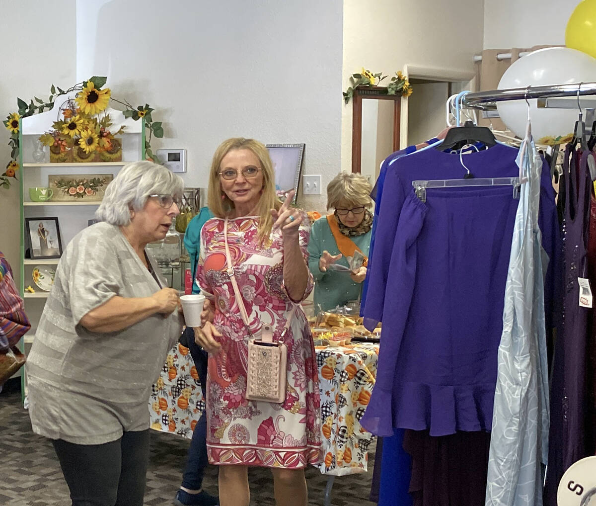 Two local shoppers admire the selection available at Sunflower Fashions during the shop's recen ...