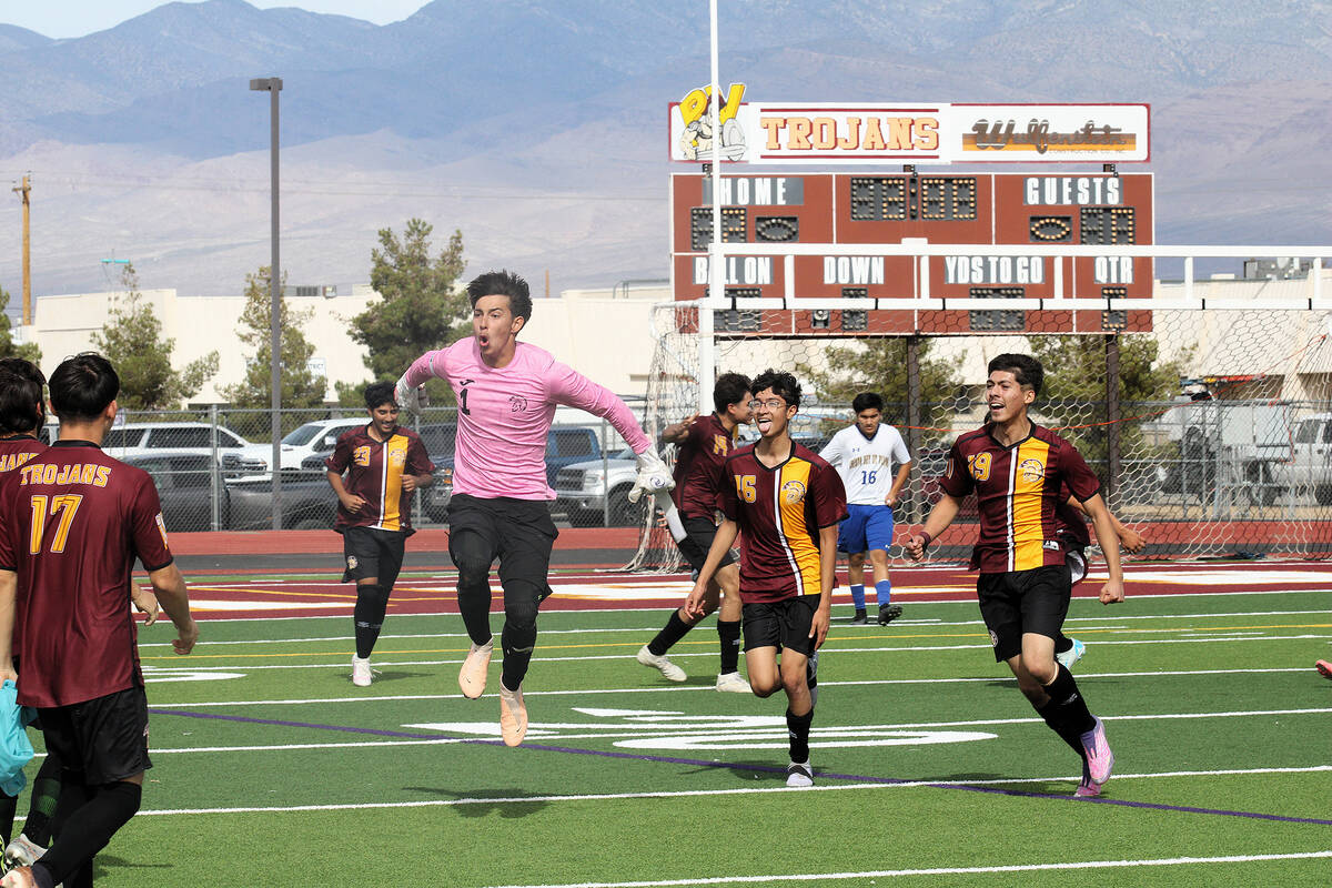 Members of the PVHS boys soccer team celebrate on their home field after a 2-0 victory during t ...