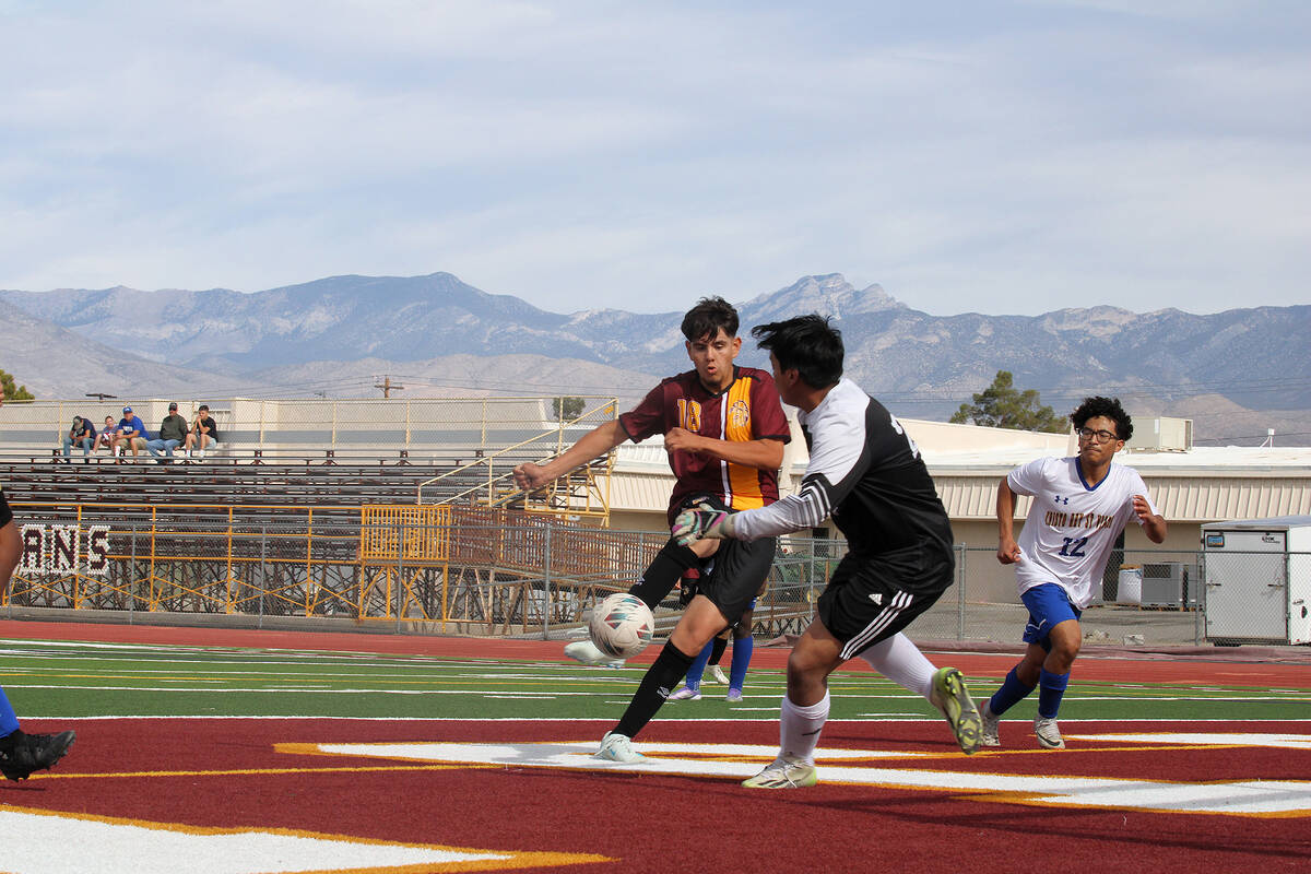 PVHS junior forward Rafael Sanchez sends the go-ahead goal past the Cristo Rey St. Viator goalk ...