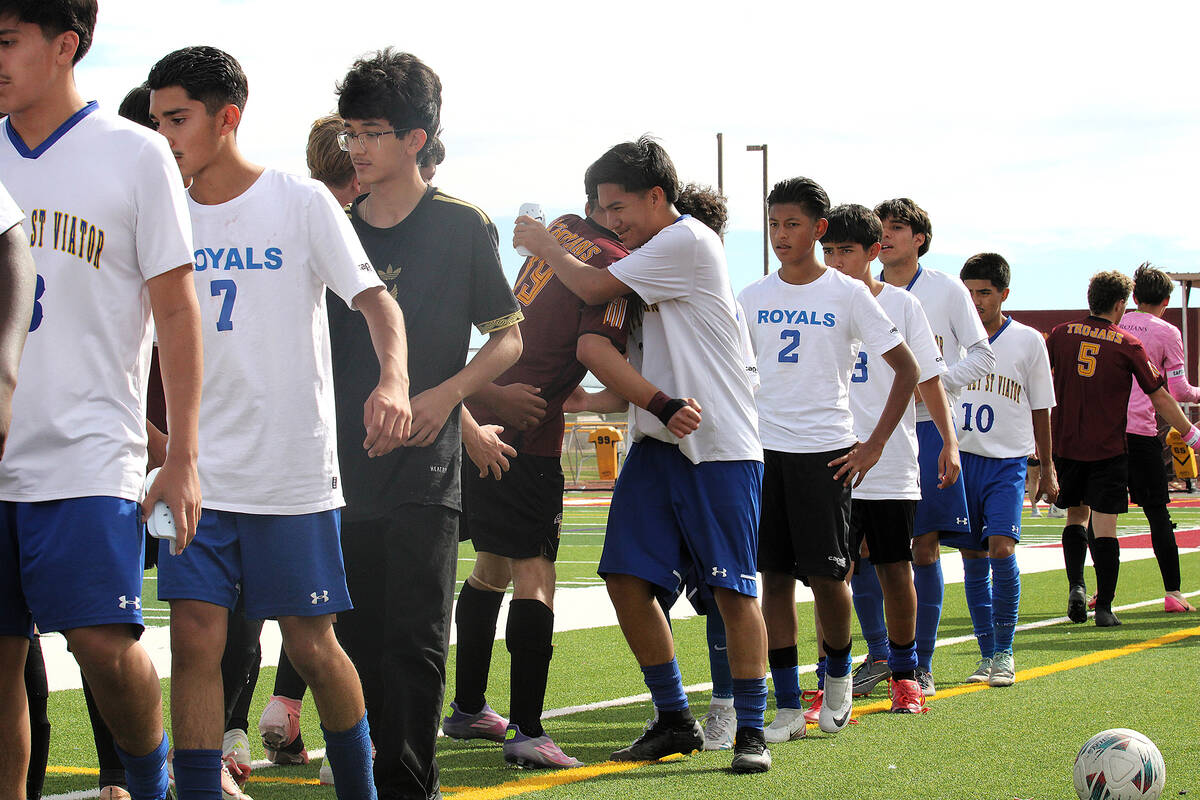 Both Cristo Rey St. Viator and Pahrump shake hands congratulating each other on a hard-fought m ...