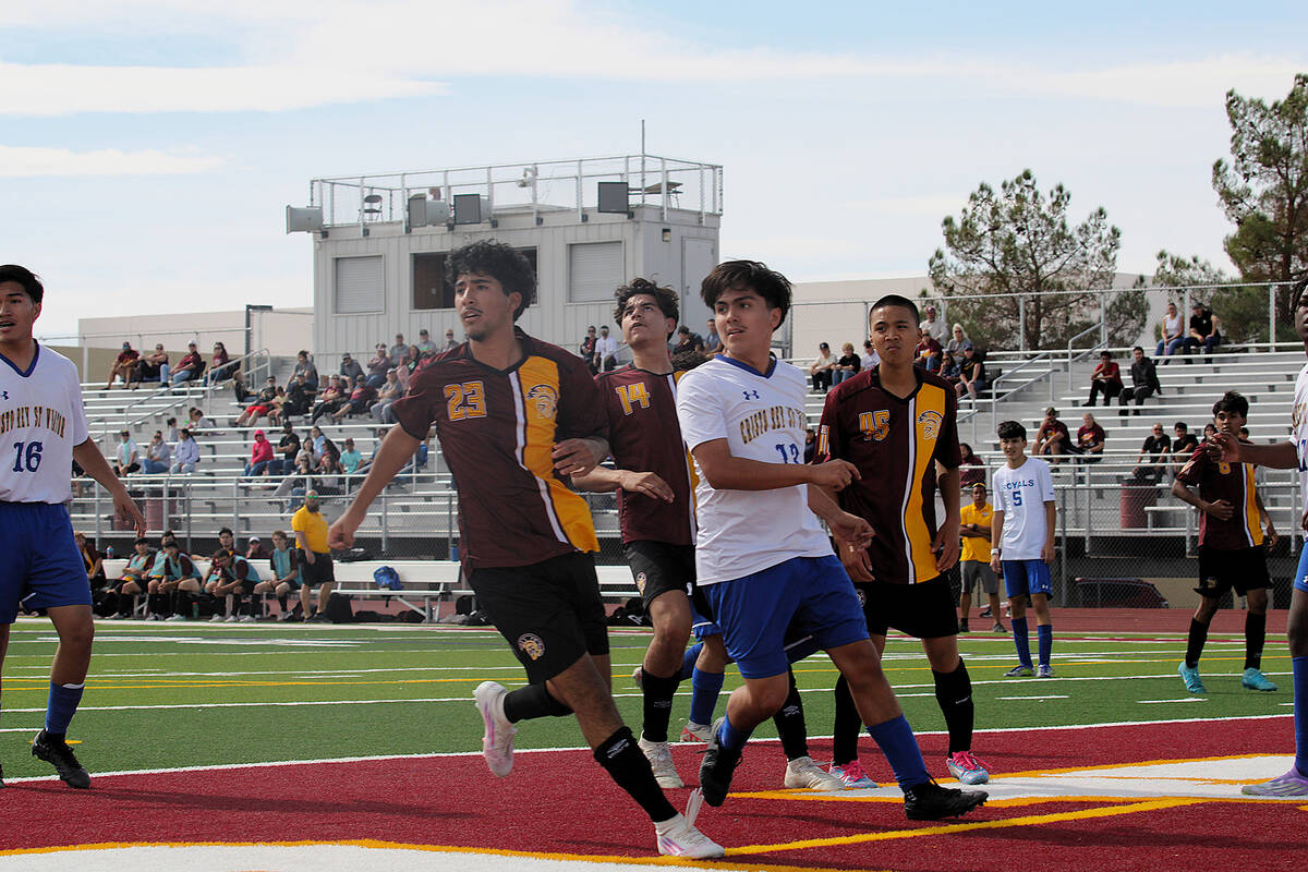 Trojans players Fayvan Sida, Adrain Dominguez-Leyva and Randall Pangilinan set up in the box to ...