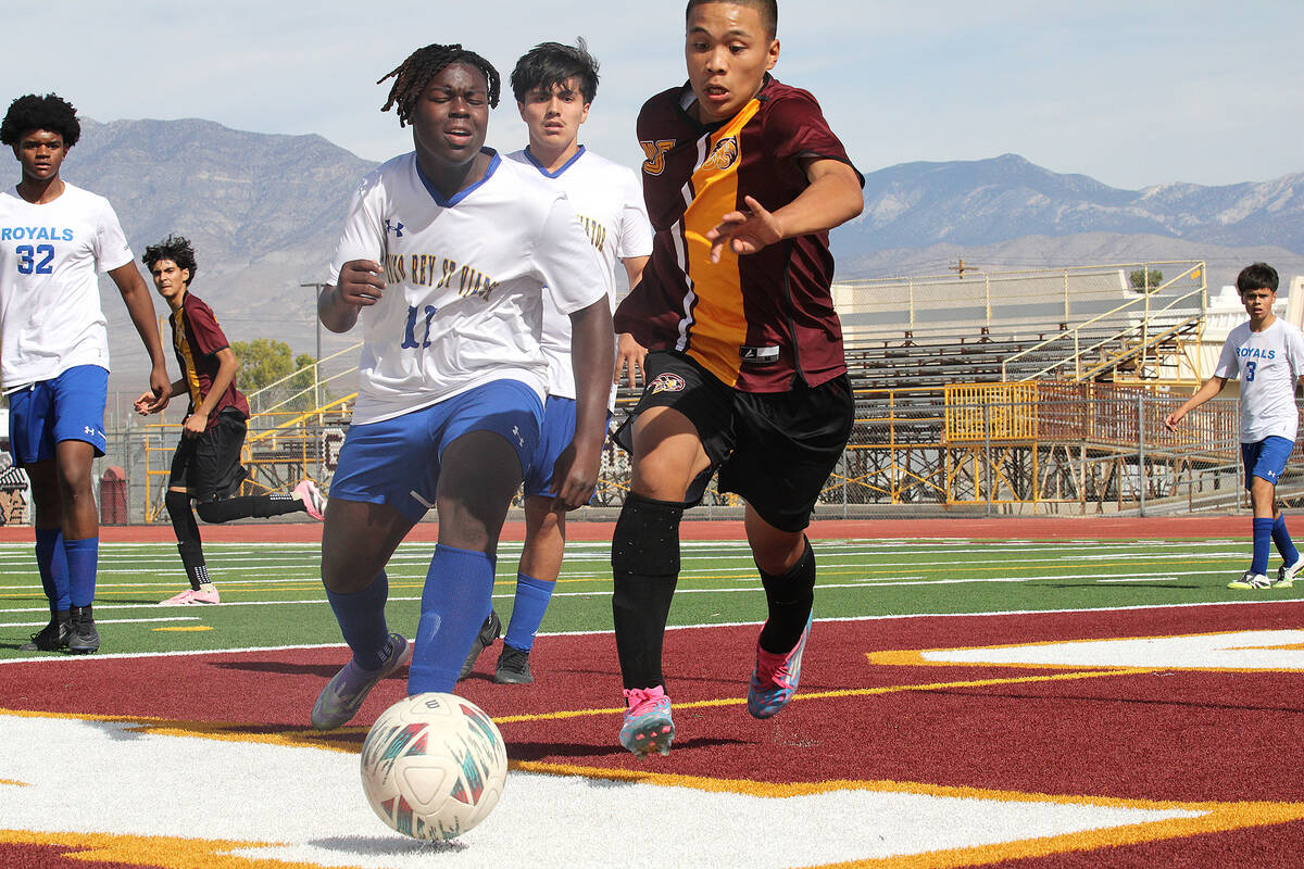 PVHS sophomore midfielder Randall Pangilinan battles for a ball going out of bounds in a Class ...