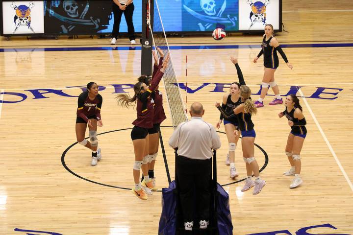 Pahrump Valley High School volleyball players Riley Saldana and Marayah Waller give their best ...