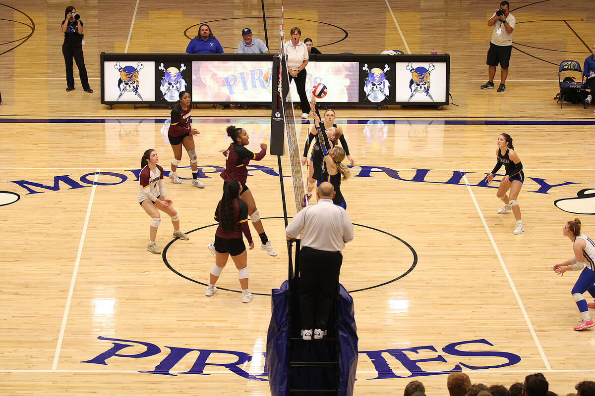 The Trojans front line battles hard during a long rally against Moapa Valley on the road in the ...