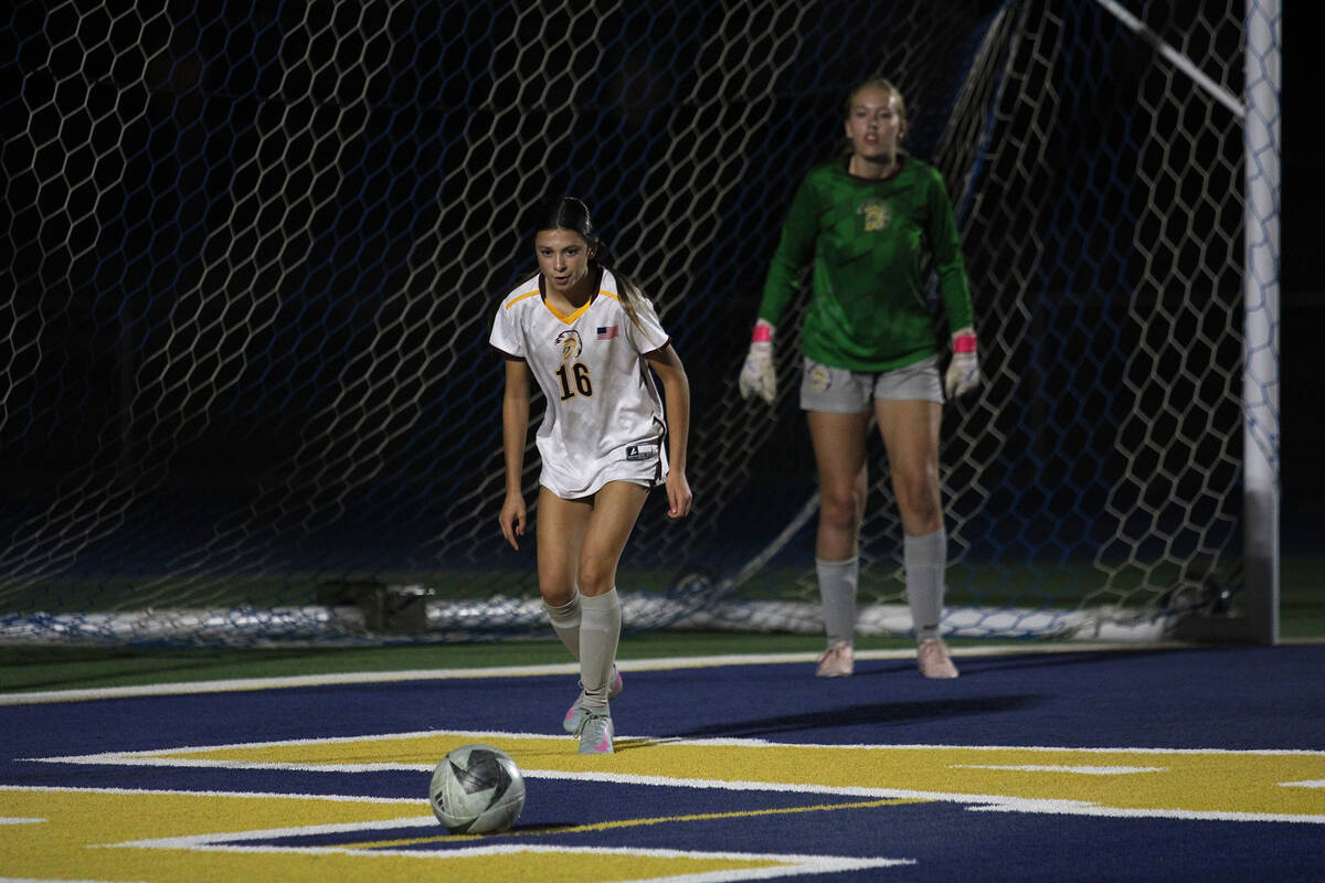 PVHS girls soccer sophomore Kylee Lusk prepares to send a free kick out of the Trojans box duri ...