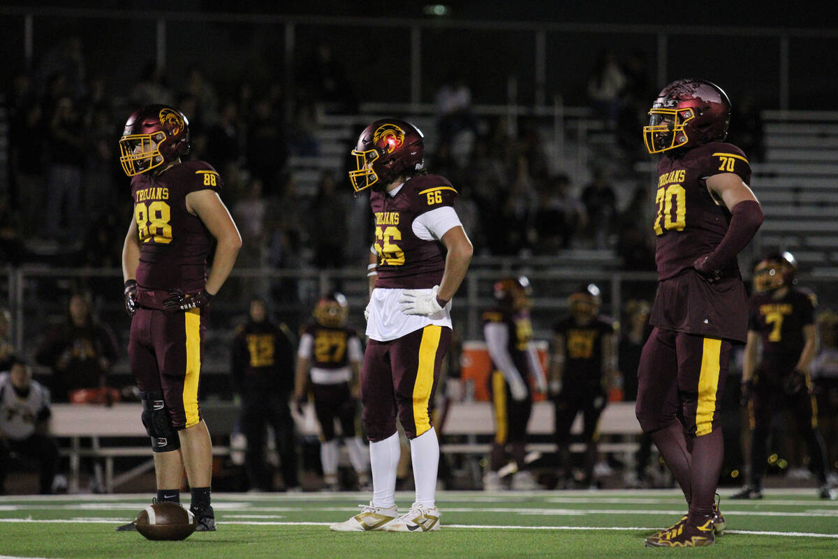 PVHS defenders Gideon Wydick, Jack Walker and Billy Sparks anchor the Trojans defensive line as ...