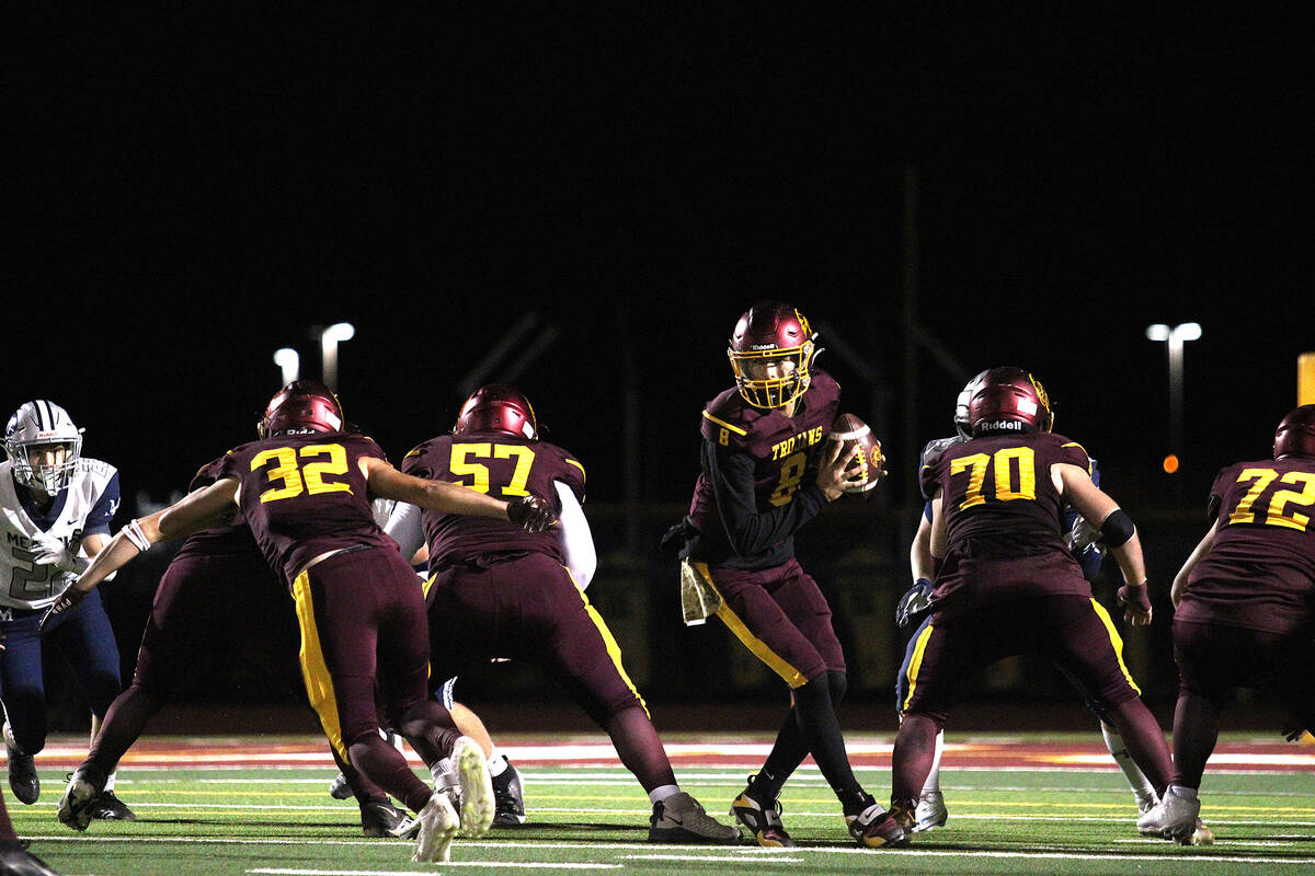 PVHS senior QB Kayne Horibe prepares to pitch the ball off to senior RB/SS Austin Alvarez durin ...