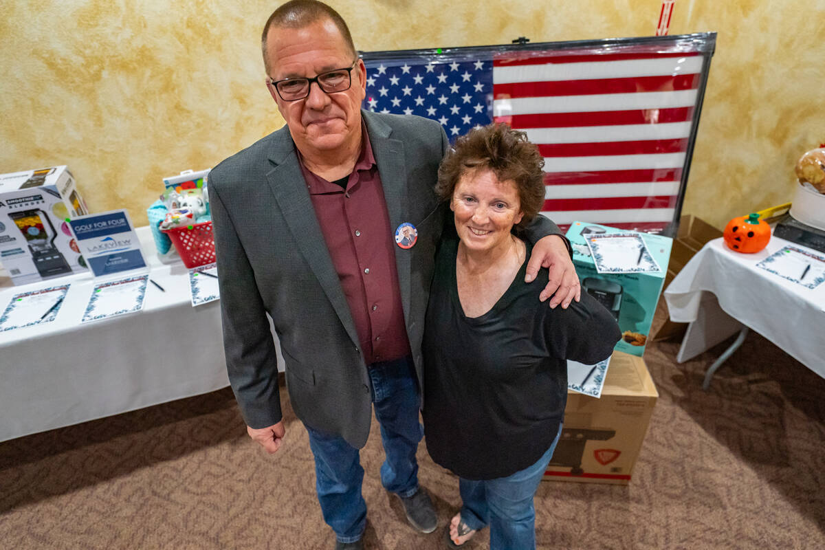Sheriff Joe McGill poses with his wife. McGill was not in uniform, and therefore not on duty, ...