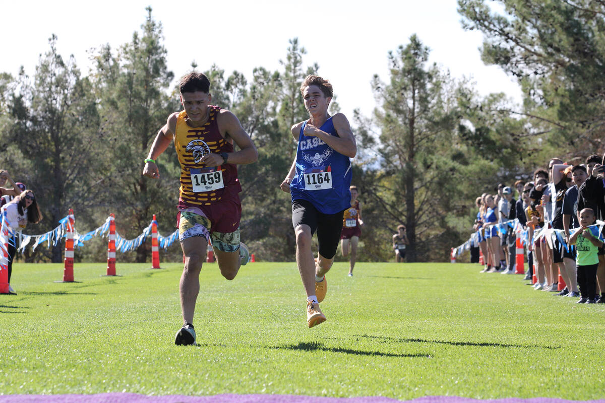 PVHS senior Benjamin DeSantiago finishes just in front of Coral Academy of Science junior Joshu ...