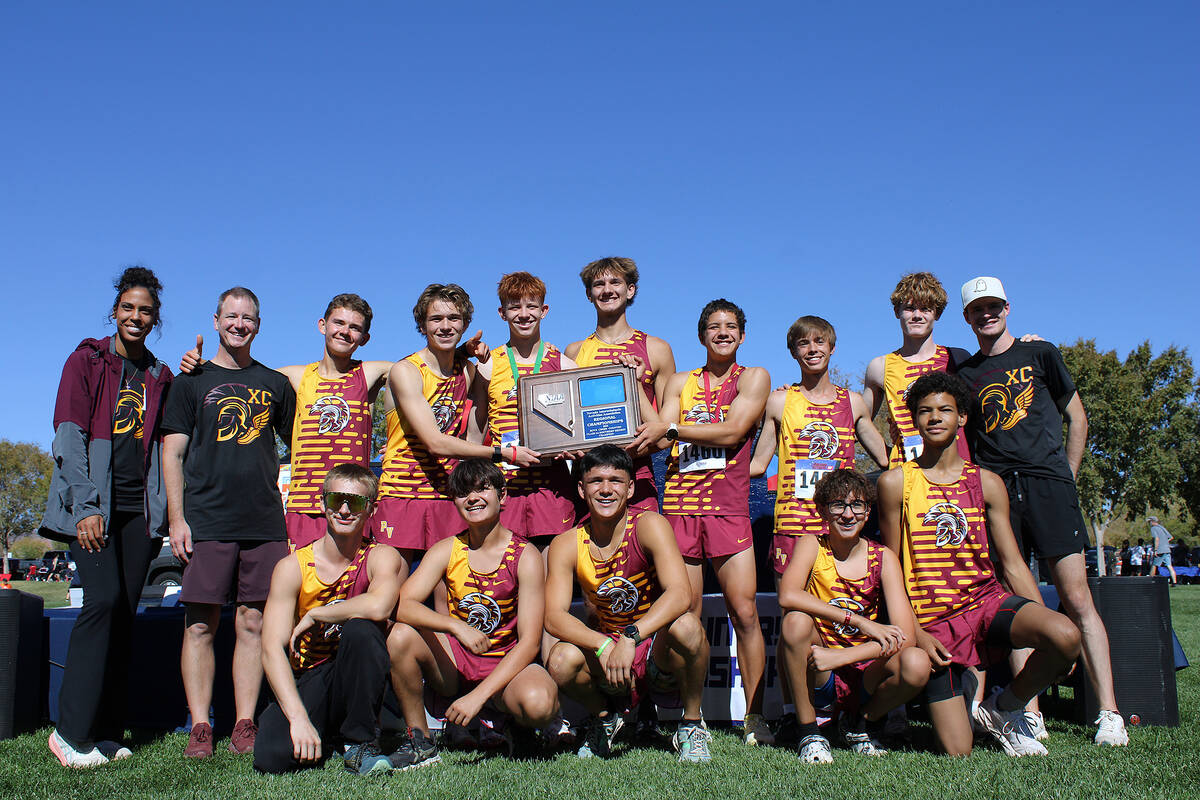 The PVHS boys XC team proudly displays their Class 3A Southern Regional title at Veterans Memor ...