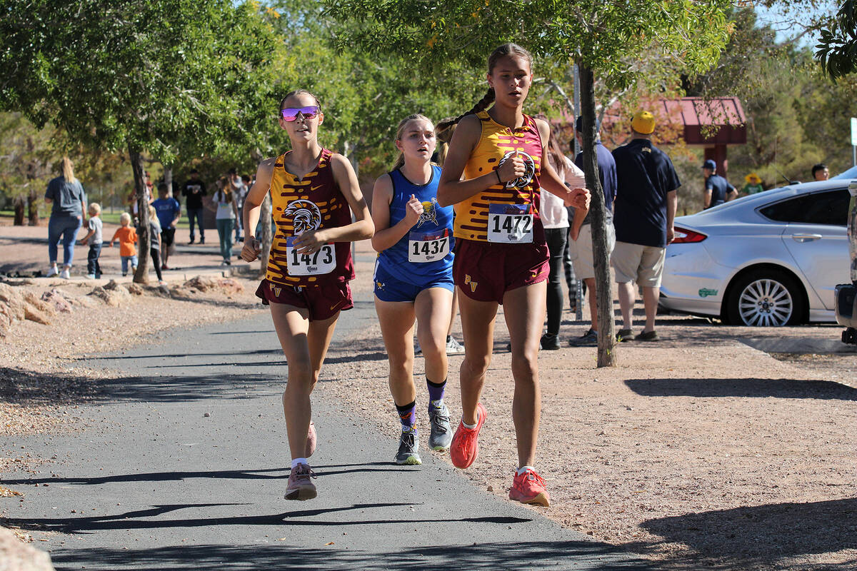 PVHS girls XC sophomore Adelin Nelson and junior Rosie Miller pull ahead of a Moapa Valley runn ...