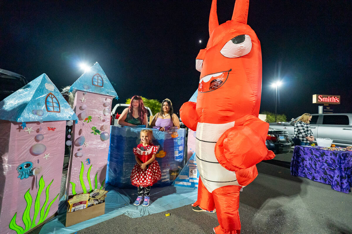Trick-or-treaters at the Smith’s trunk-or-treat location enjoyed plenty of candy. (John Claus ...