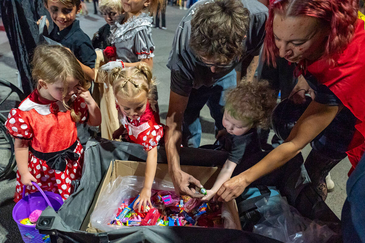 Trick-or-treaters at the Smith’s trunk-or-treat location enjoyed plenty of candy from Desert ...
