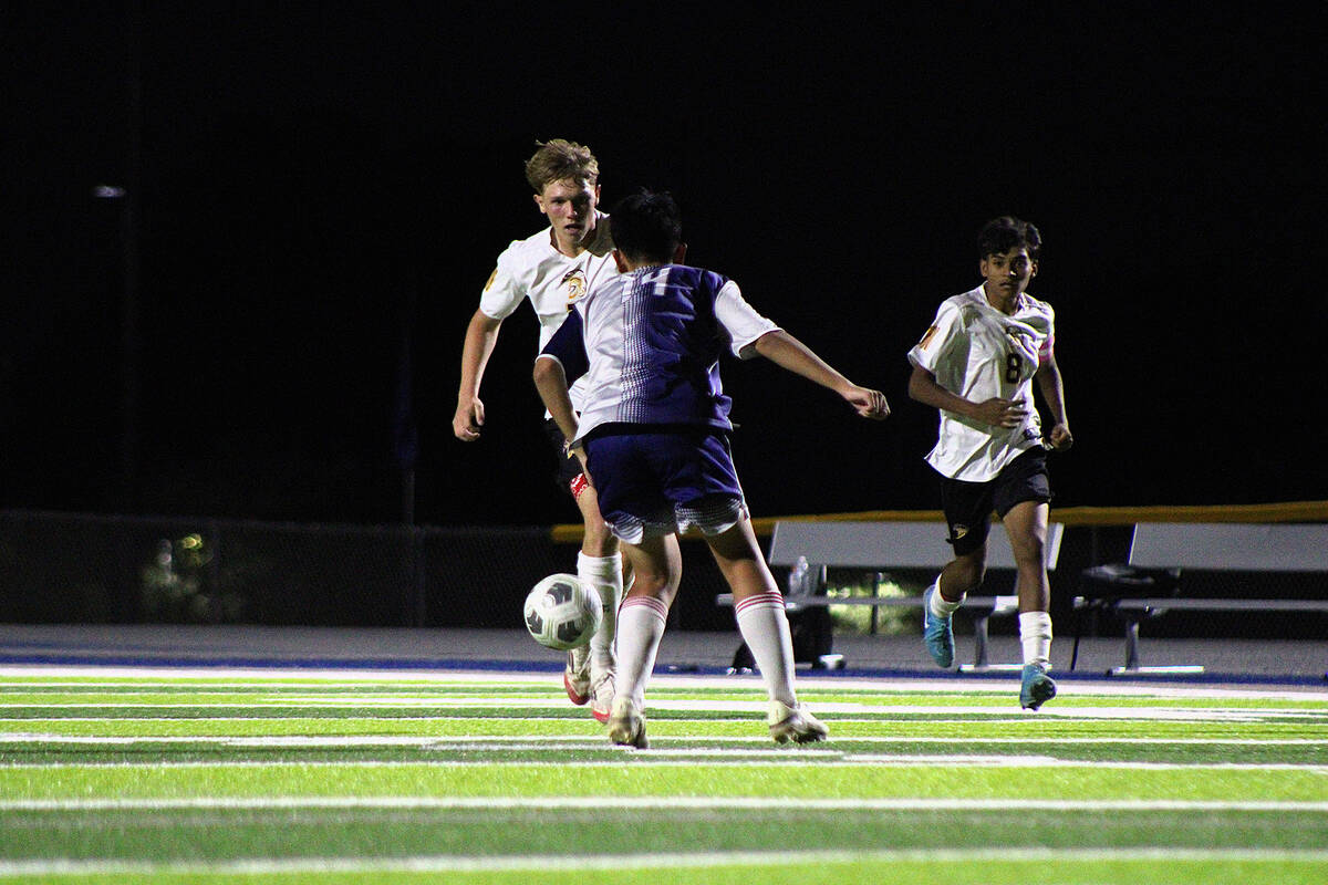 PVHS junior midfielder TC Hone advances the ball near The Meadows box in an away league match d ...