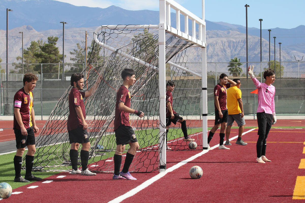 The Pahrump Valley High School boys varsity soccer team gets warmed up before their home playof ...