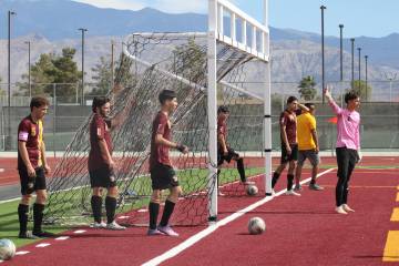 The Pahrump Valley High School boys varsity soccer team gets warmed up before their home playof ...
