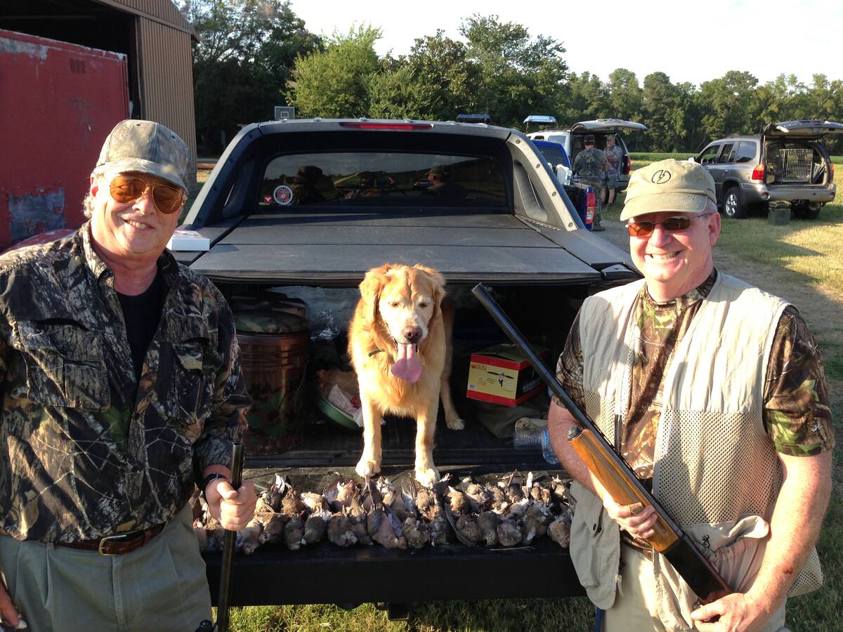 George Fenton and a hunting friend appreciate a canine hunting partner, like "Charlie" the dog, ...