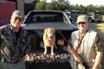 George Fenton and a hunting friend appreciate a canine hunting partner, like "Charlie" the dog, ...