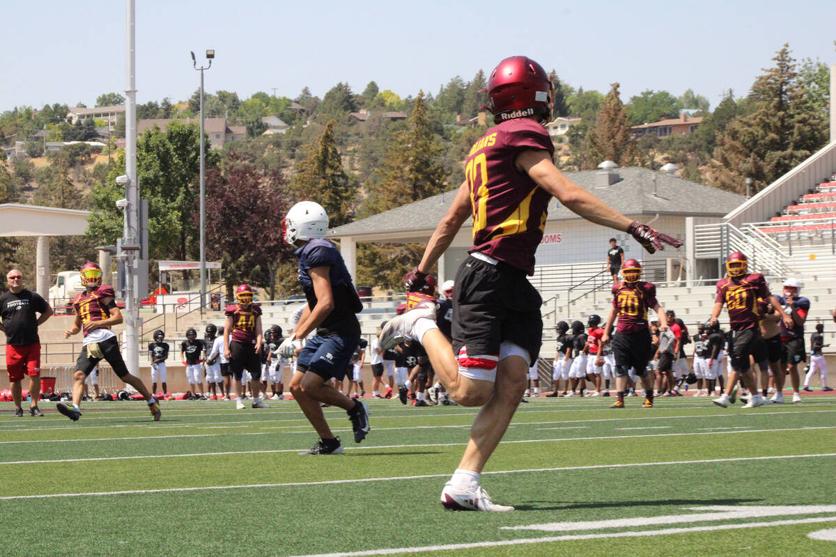 PVHS senior quarterback Kayne Horibe dials up a pass to senior RB/OLB Austin Alvarez during the ...