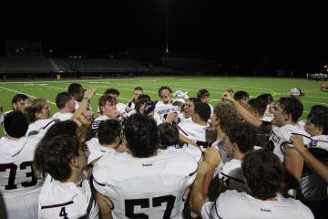 The Pahrump Valley High School football team celebrates after a road win against Cheyenne High ...