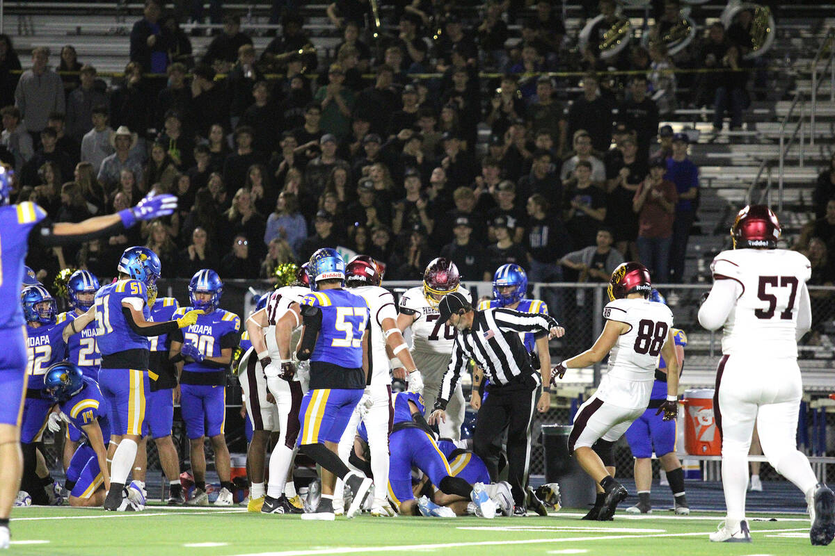 Moapa Valley argues that the ball belongs to them after a fumble is sorted out by the officials ...