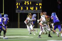Pahrump Valley High School senior ATH/RB/FS Austin Alvarez carries the ball past the 42-yard li ...