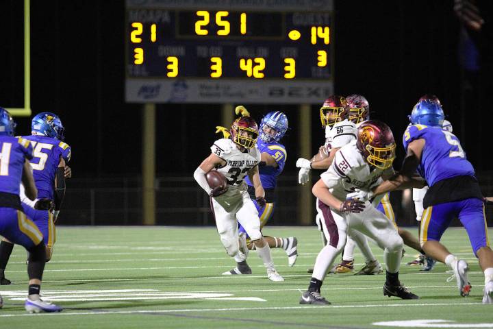 Pahrump Valley High School senior ATH/RB/FS Austin Alvarez carries the ball past the 42-yard li ...