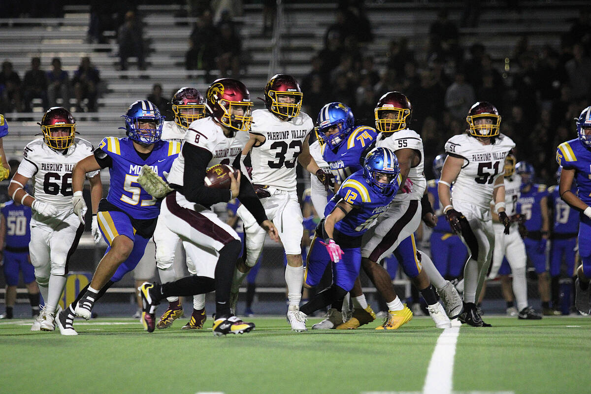 PVHS senior quarterback Kayne Horibe keeps the ball himself on a designed quarterback keeper, p ...