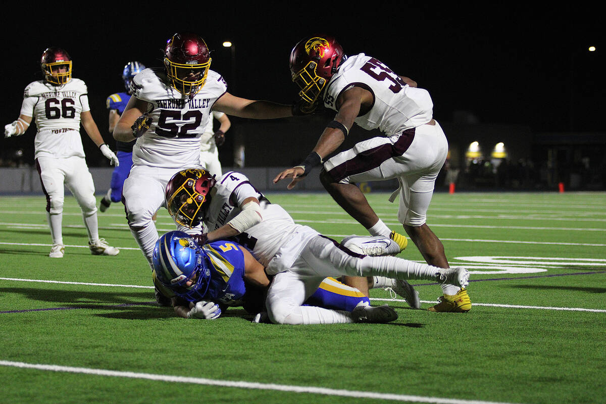 PVHS senior S/WR Booey Mclard makes a tackle to avoid Moapa Valley's junior RB/LB Briggs Hickma ...