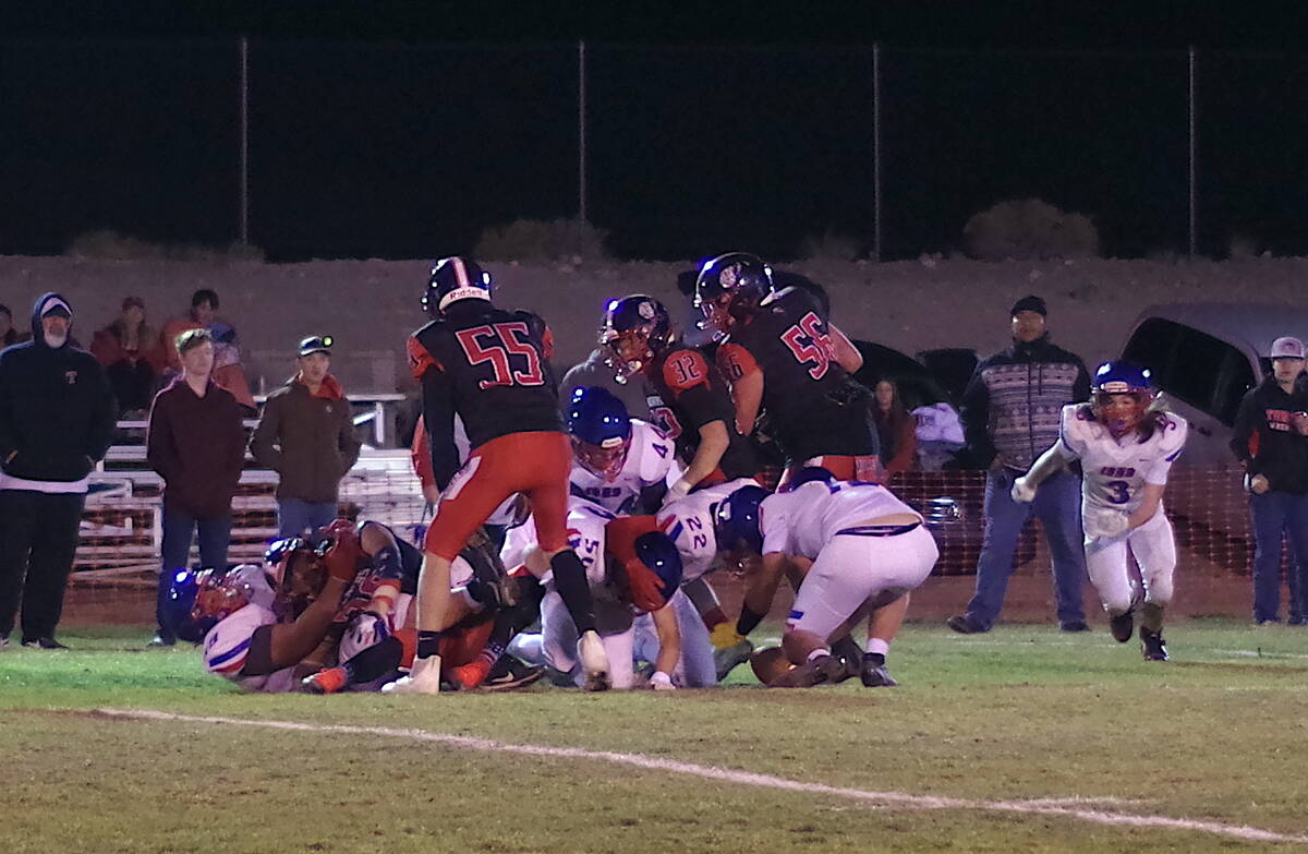 The Muckers and Firebirds fight over possession of a forced fumble during the Muckers 90-12 rou ...