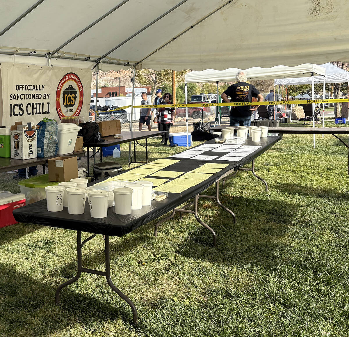 Underneath a canopy, the entries into the Beatty Days Chili Cook-off were guarded as judges too ...