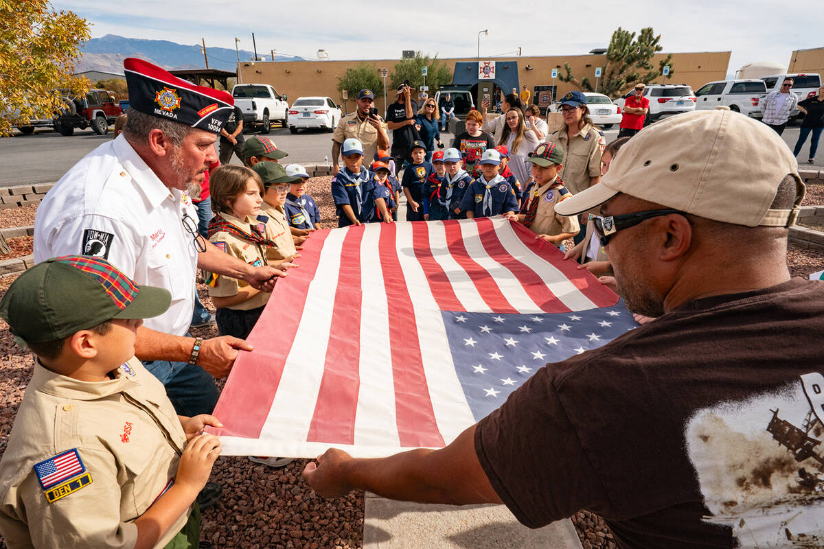 Members of the VFW teach local Cub Scouts about the proper retirement procedures for the United ...