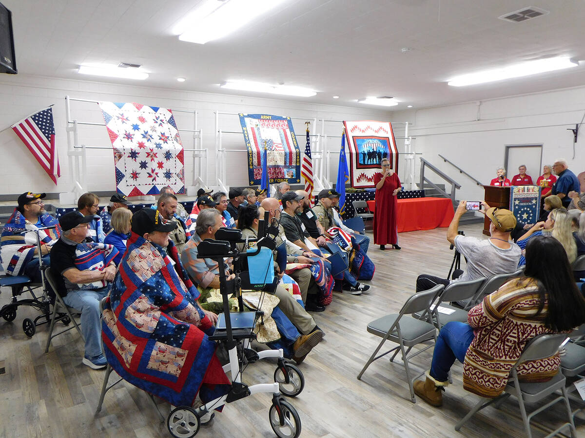 Kittra Warren serenaded the group of Quilt of Valor recipients as the Nye County Valor Quilters ...