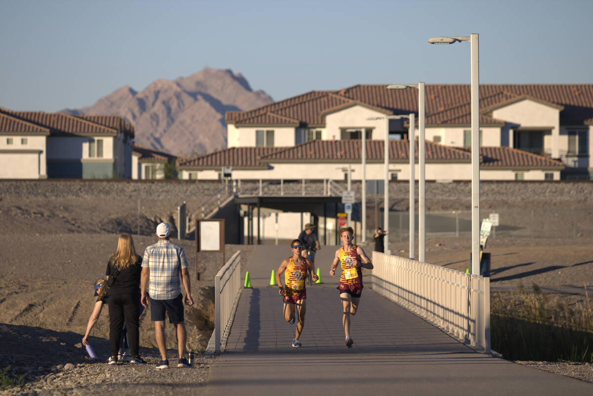 Pahrump Valley High School XC runner Joaquin Flores (left) and Joshua Gent (right) keep up with ...