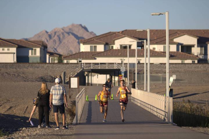 Pahrump Valley High School XC runner Joaquin Flores (left) and Joshua Gent (right) keep up with ...