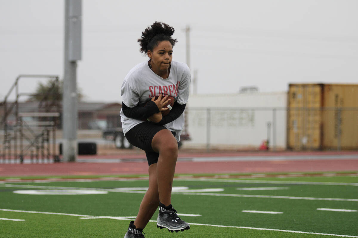 PVHS girls flag football player Aaliyah Fries successfully brings in a pass in the rain during ...