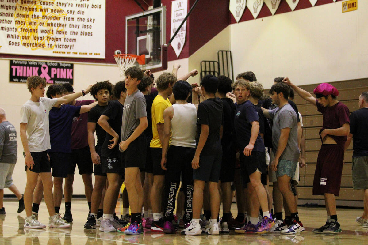 Participants working hard to make the boys basketball varsity 2025-2026 roster all huddle toget ...