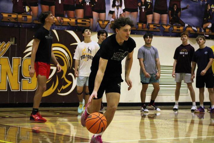 Athletes trying out for the boys basketball team run multiple drills during last Saturday's off ...