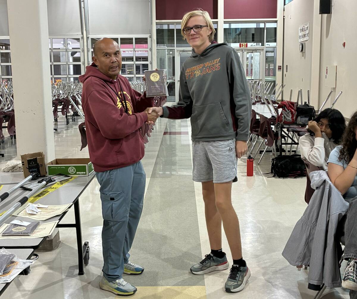 Pahrump Valley High School tennis junior Bryce Dykstra receives the coaches award during the pr ...