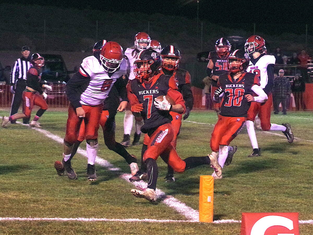 Tonopah High School junior Jacob Renfro punches the ball into the end zone during the Muckers C ...