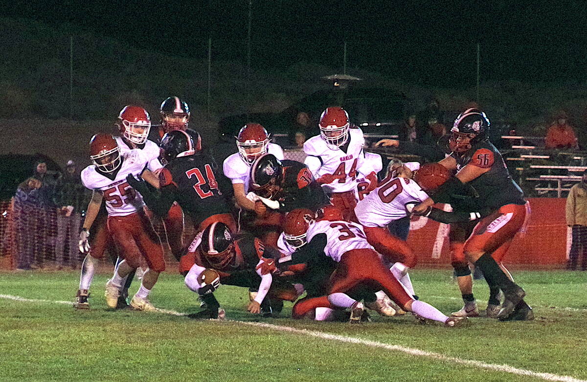 Tonopah High School Adelaido Salgado punches his was through Carlin's defenders in rout to the ...