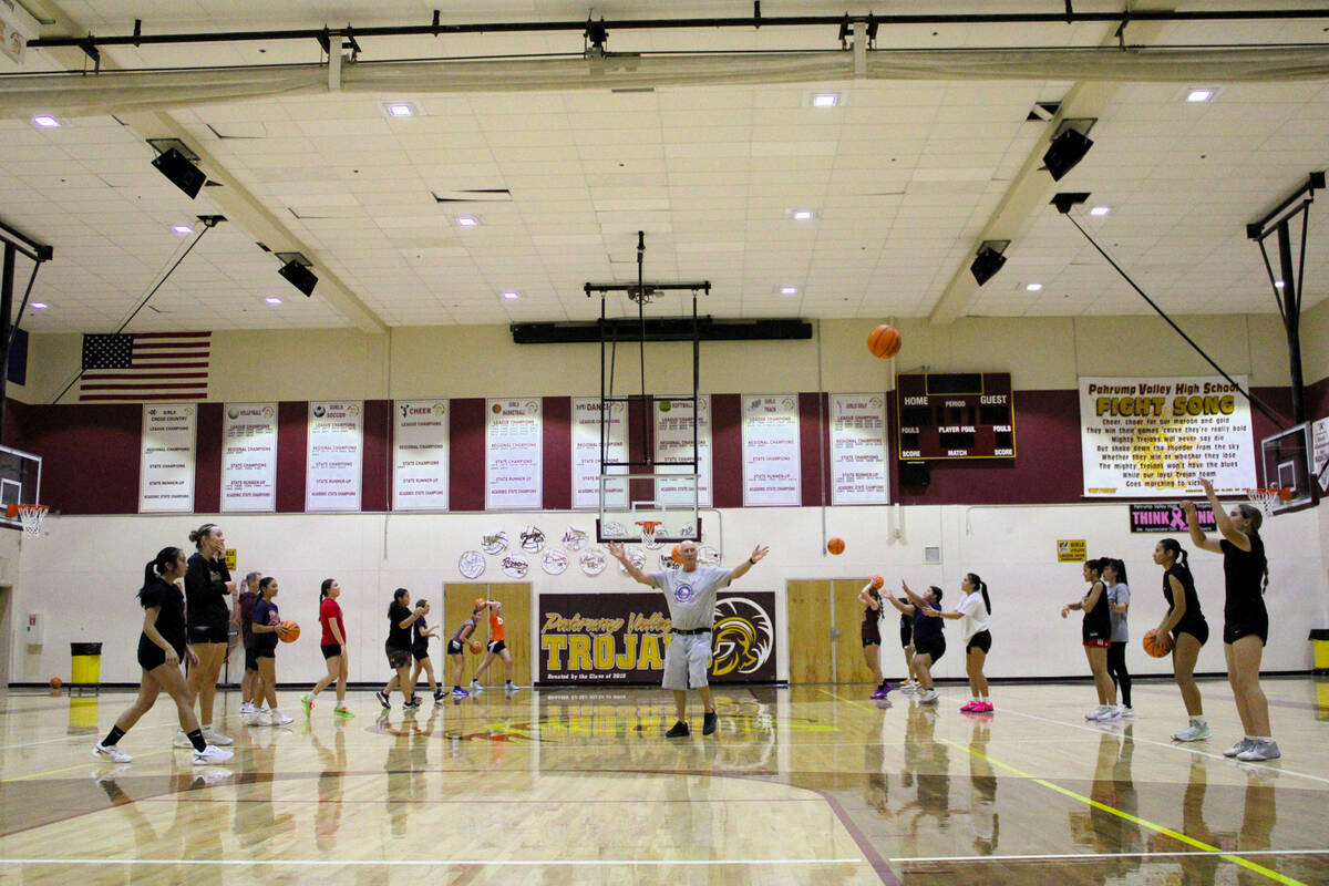 Pahrump Valley High School girls basketball head coach Bob Hopkins gives detailed instructions ...
