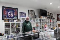 Pahrump Sports Cards shop owner Ernie Desaye proudly stands behind his "work in progress" to ge ...